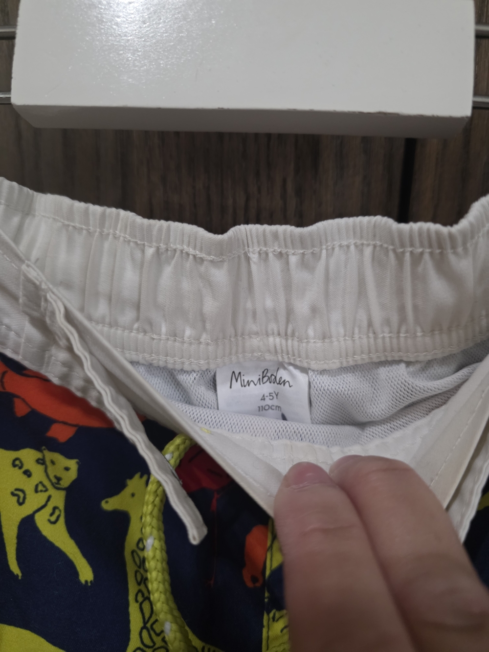 Mini Boden Navy Swim Trunks with Multicolor Animal Print - Picture 2 of 4